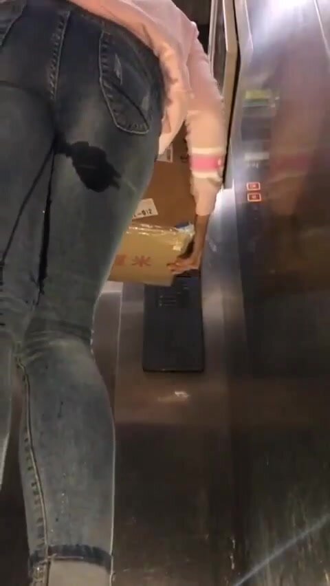 Chinese girl peeing in elevator