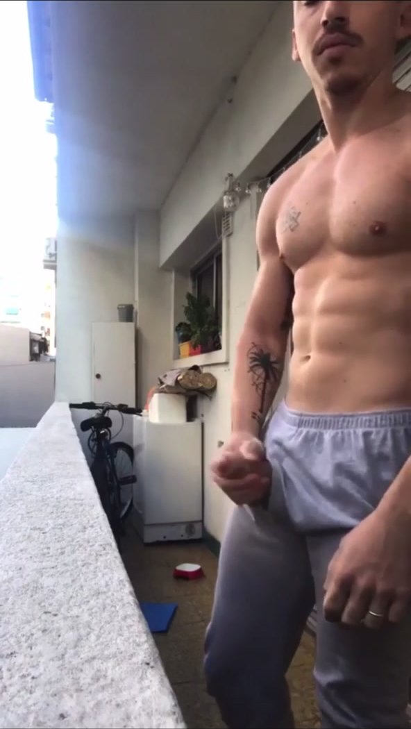 Married latino daddy jerks cock on his public balcony