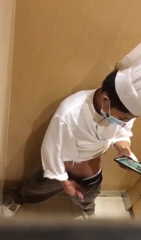 Chef jerking off and cumming in toilet stall.