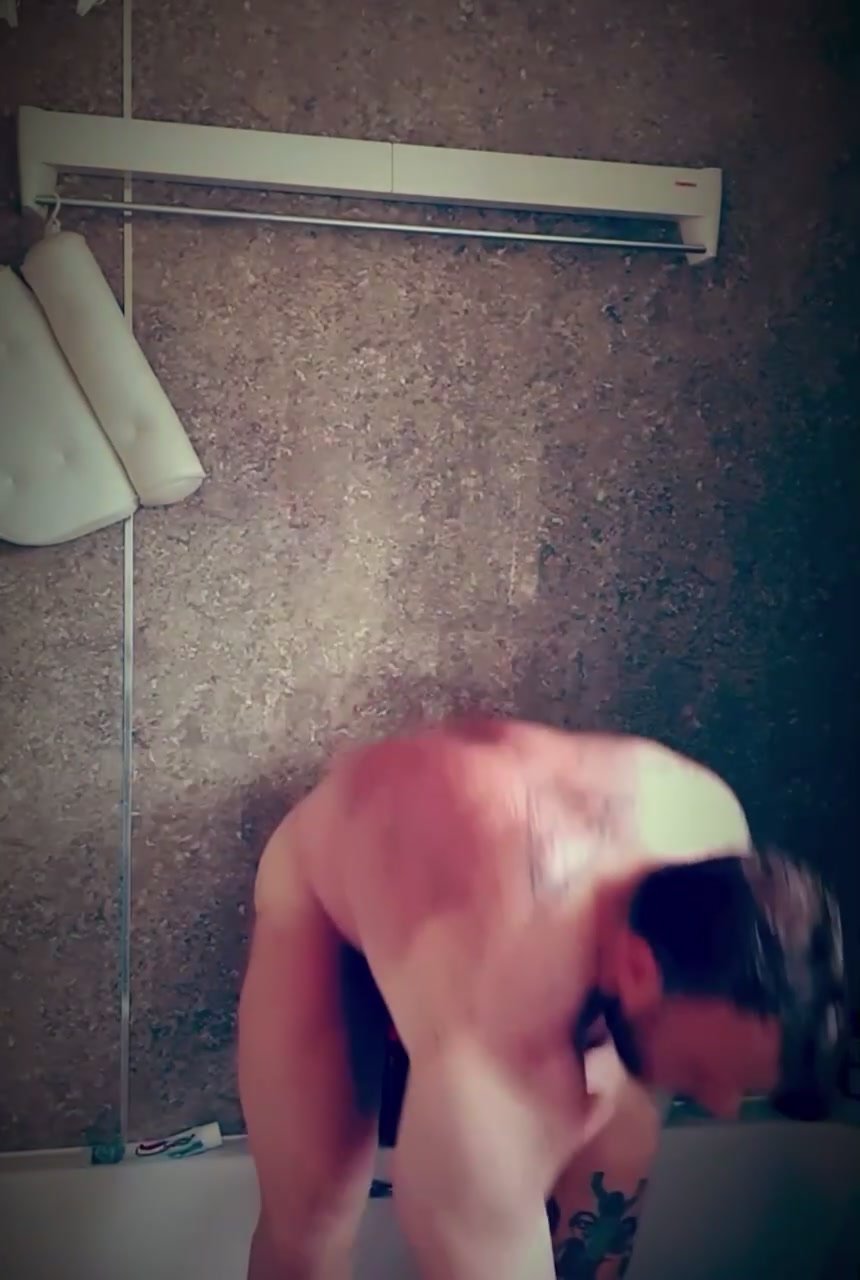 Bodybuilder getting out of the shower
