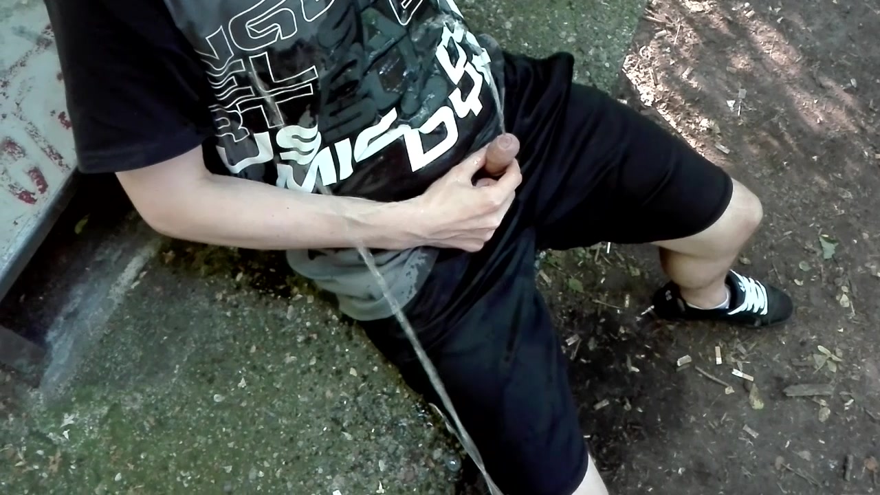 Pissing together on my clothes in a park