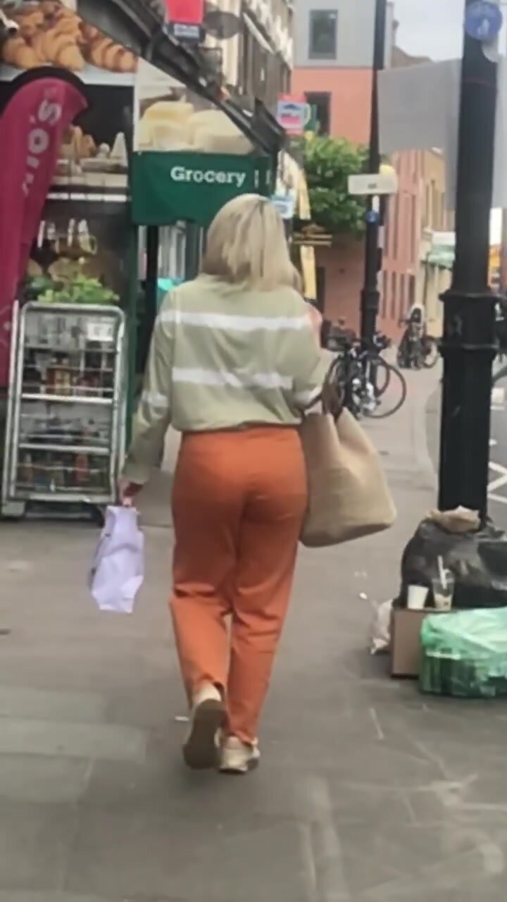 Following a blonde pawg in orange jeans