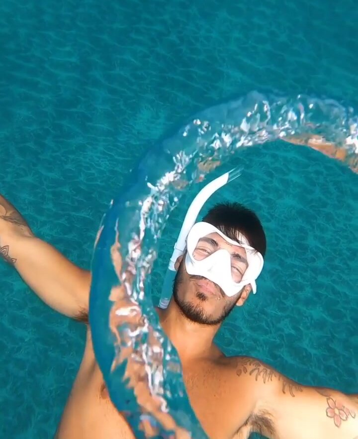Underwater white mask hottie blowing bubbles