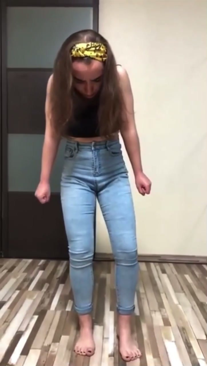Cute girl wets jeans