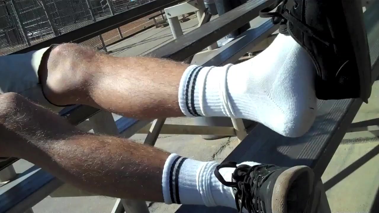 Blond guy shows his feet and socks