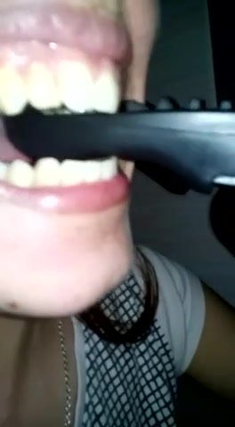girl destoy a control with her sharp teeth