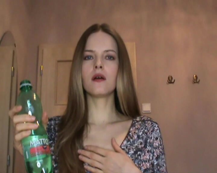German girl drinking and burping