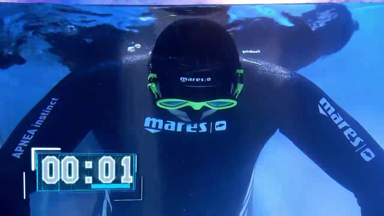 Spanish singer long underwater breathold in wetsuit