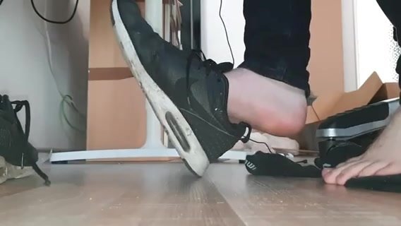 Boy shoe play under desk