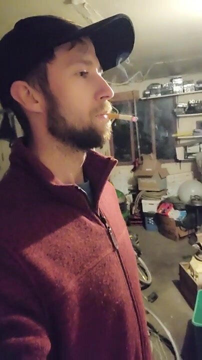 Young Guy Smoking in Garage