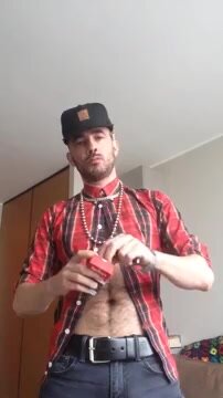 Masc thug shows off bling and belly