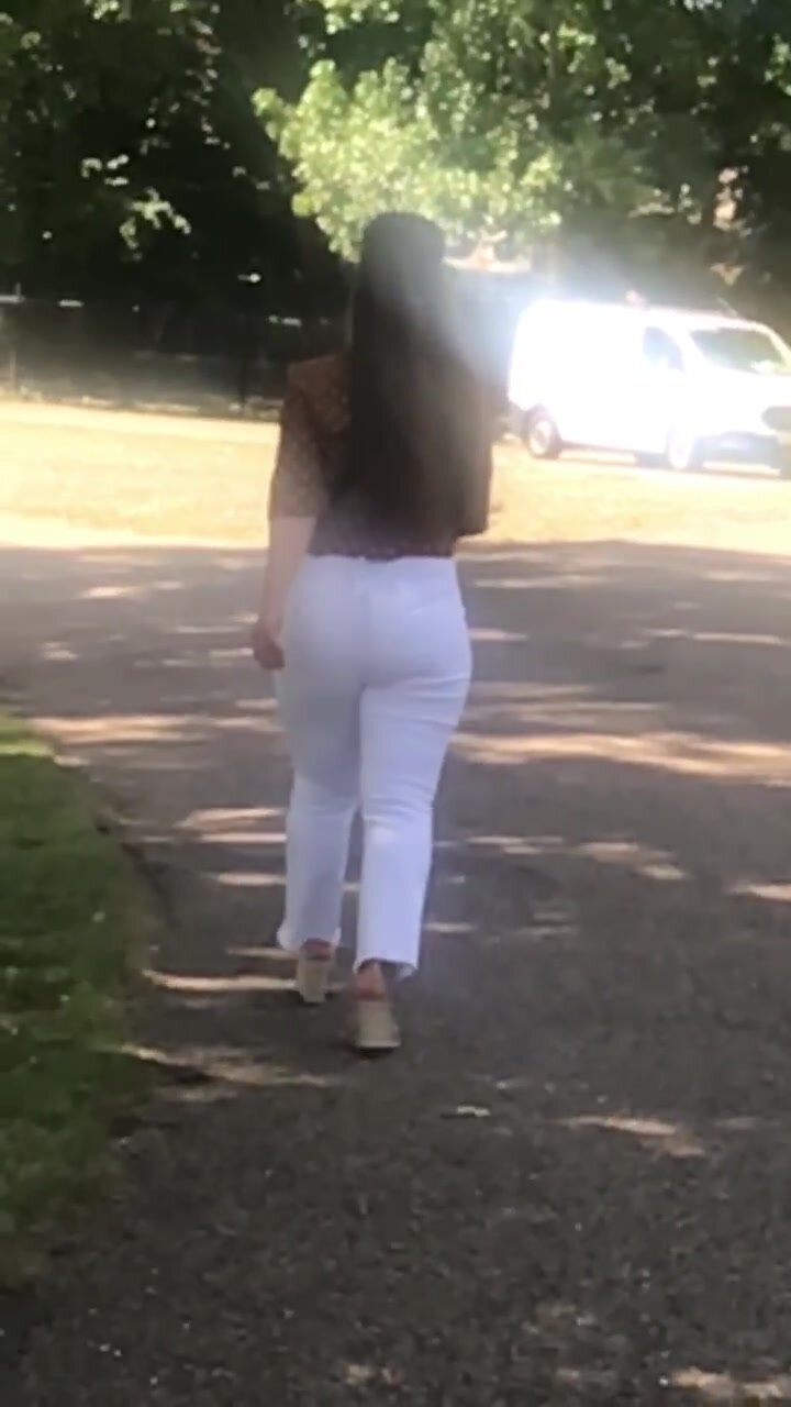 Sexy brunette in white pants