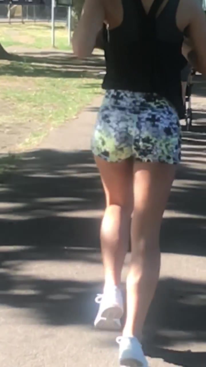 Petite girl running in shorts