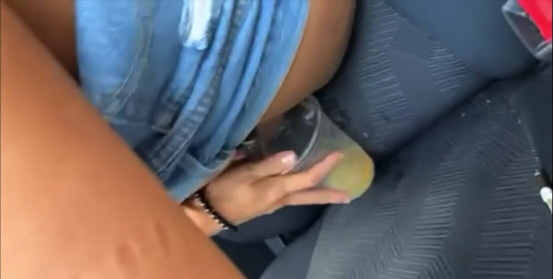 Girl pissing in a cup
