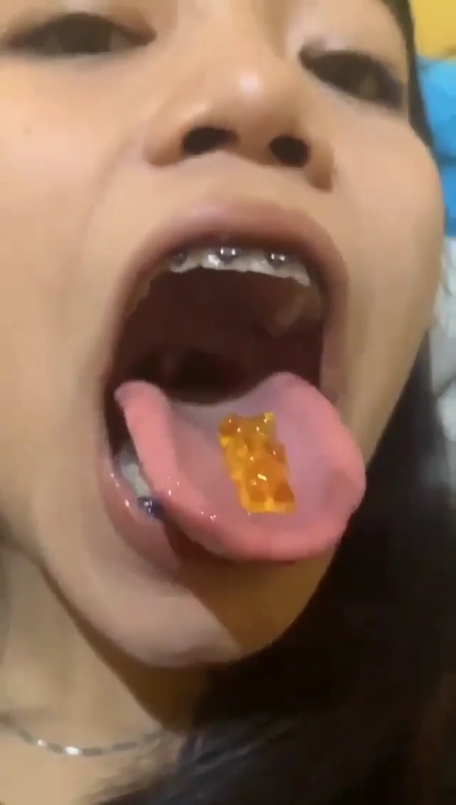 Girl swallowing gummy