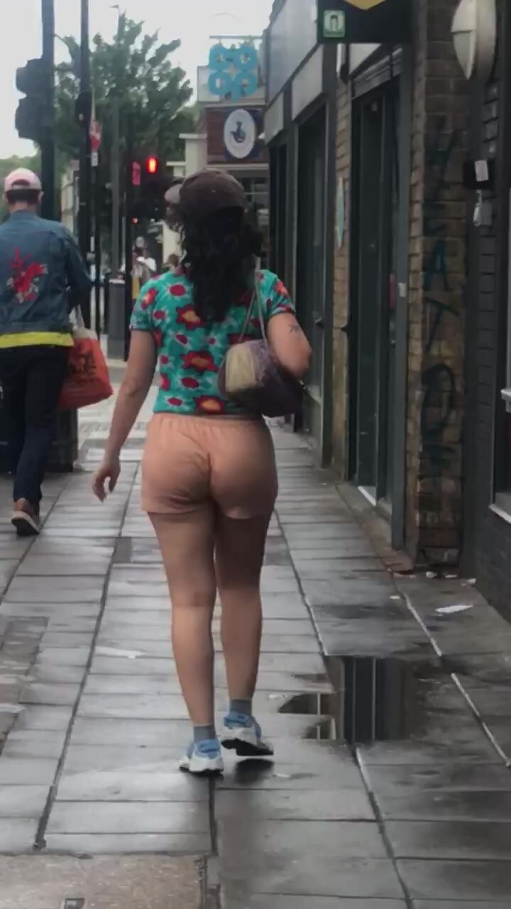 Sexy brunette walking in shorts