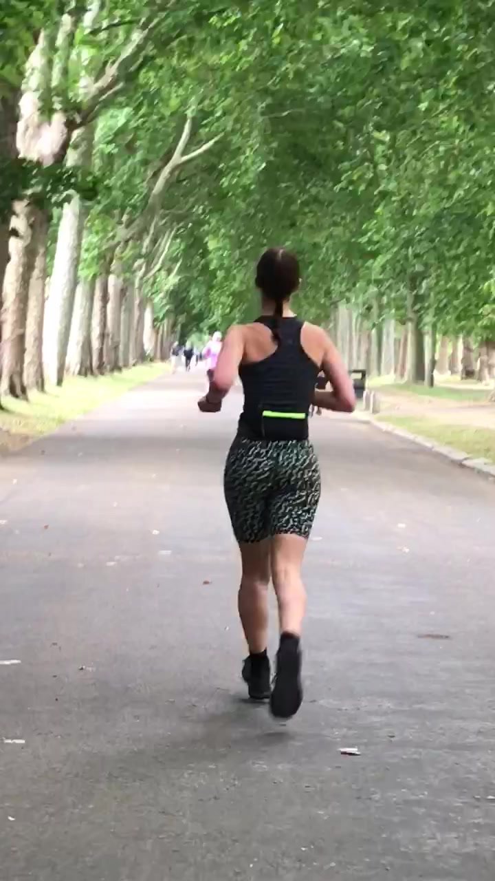 Slim and sexy brunette running in hotpants