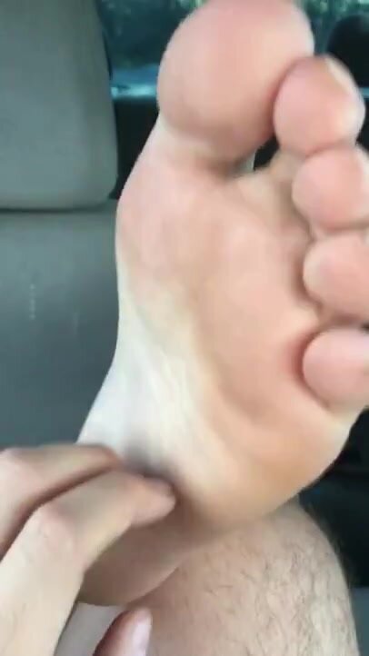 Tickling his boyfriends cute feet in the car