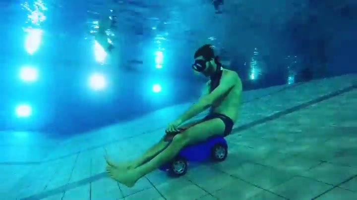 Barefeet underwater breathold on baby car