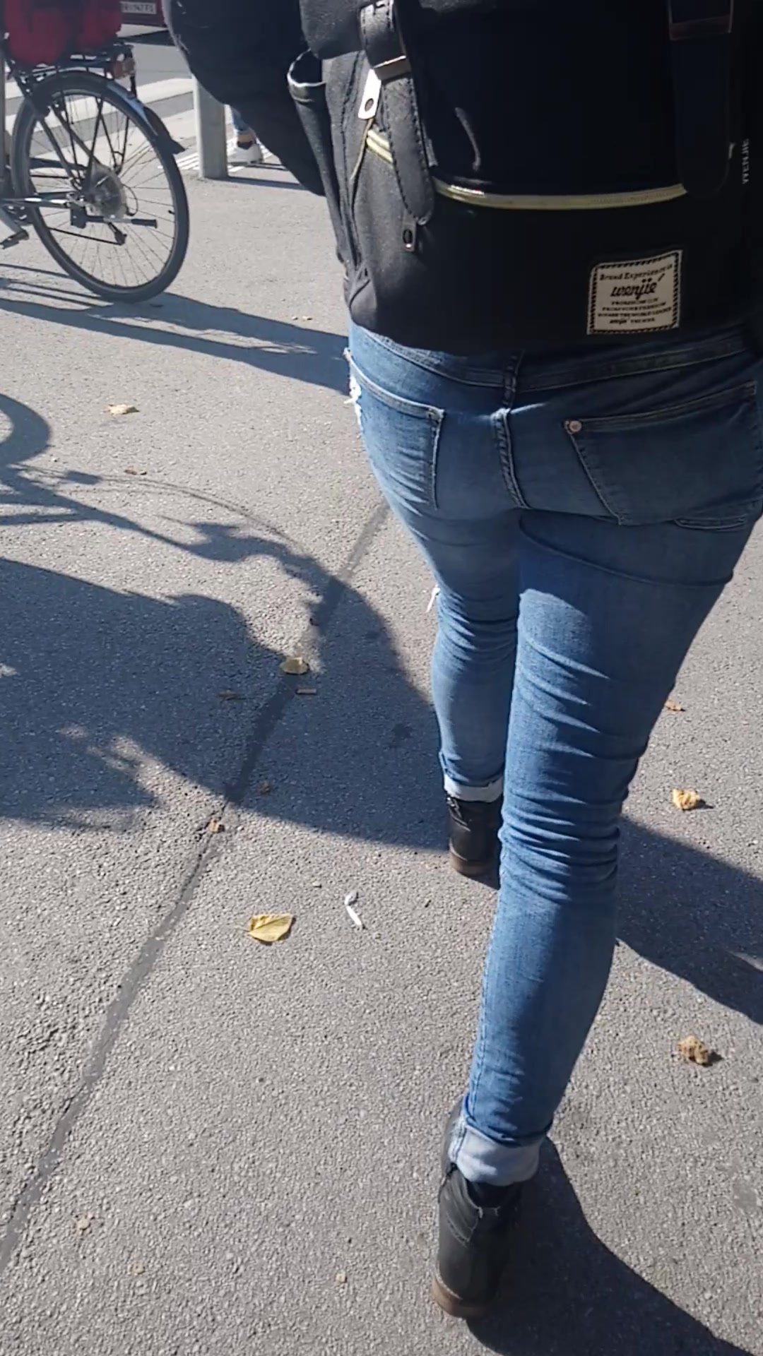 School girl in tight jeans walking