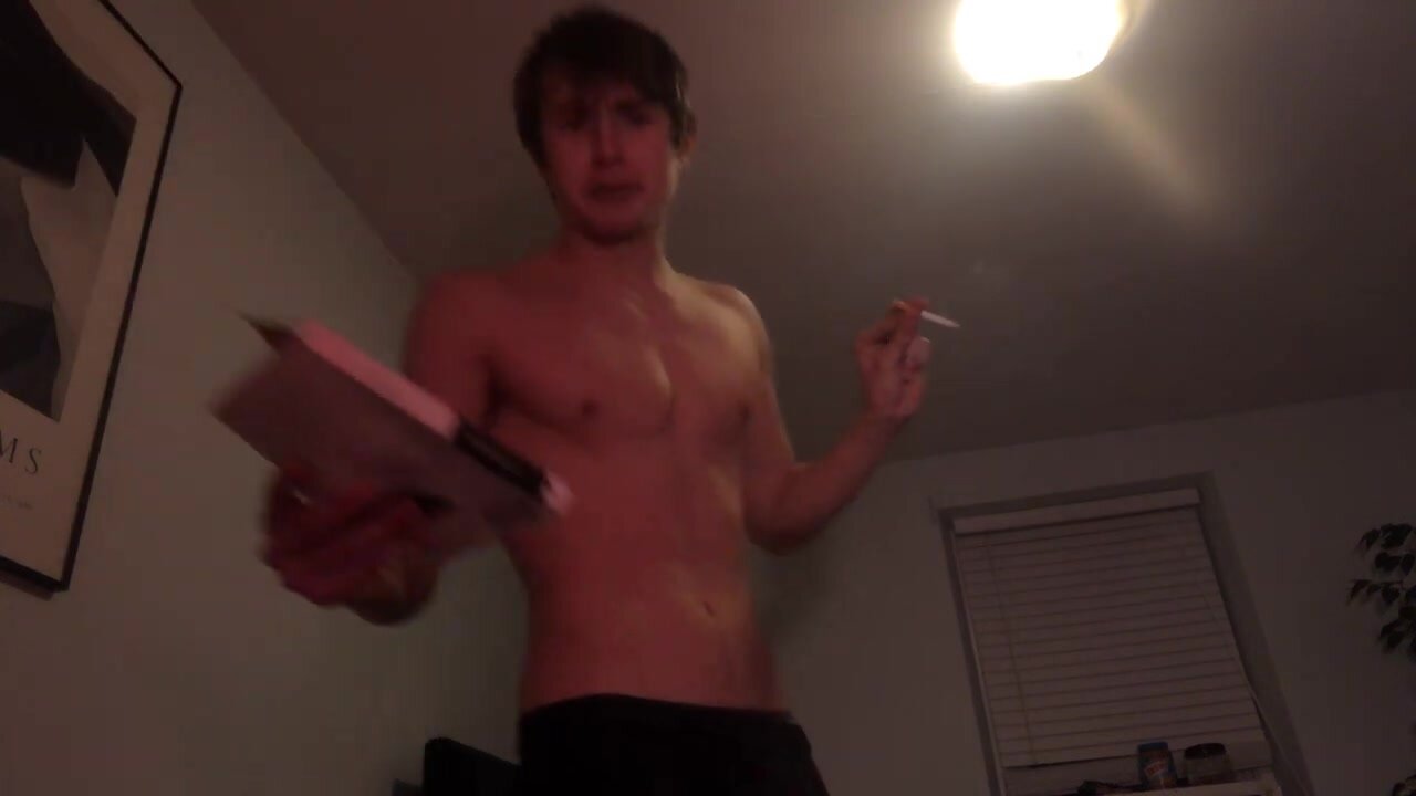 Smoking a cigarette shirtless