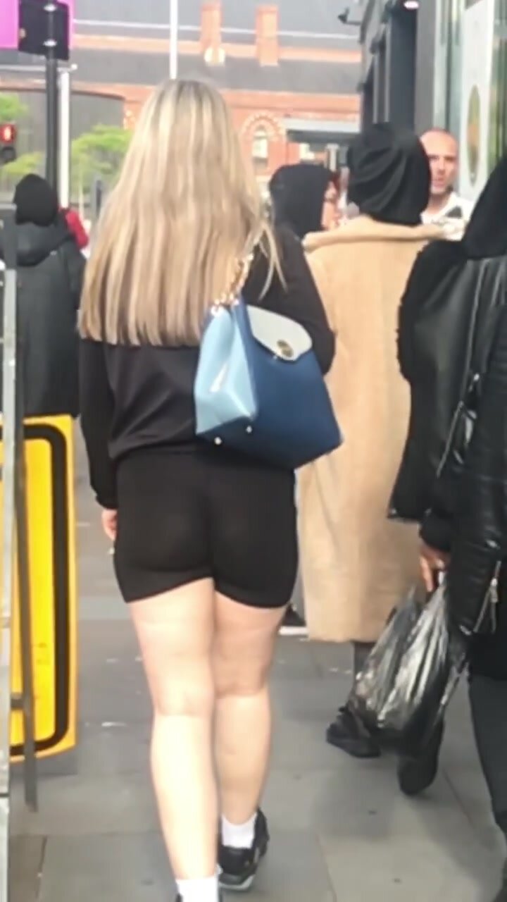 Blonde teen in hotpants walking in public