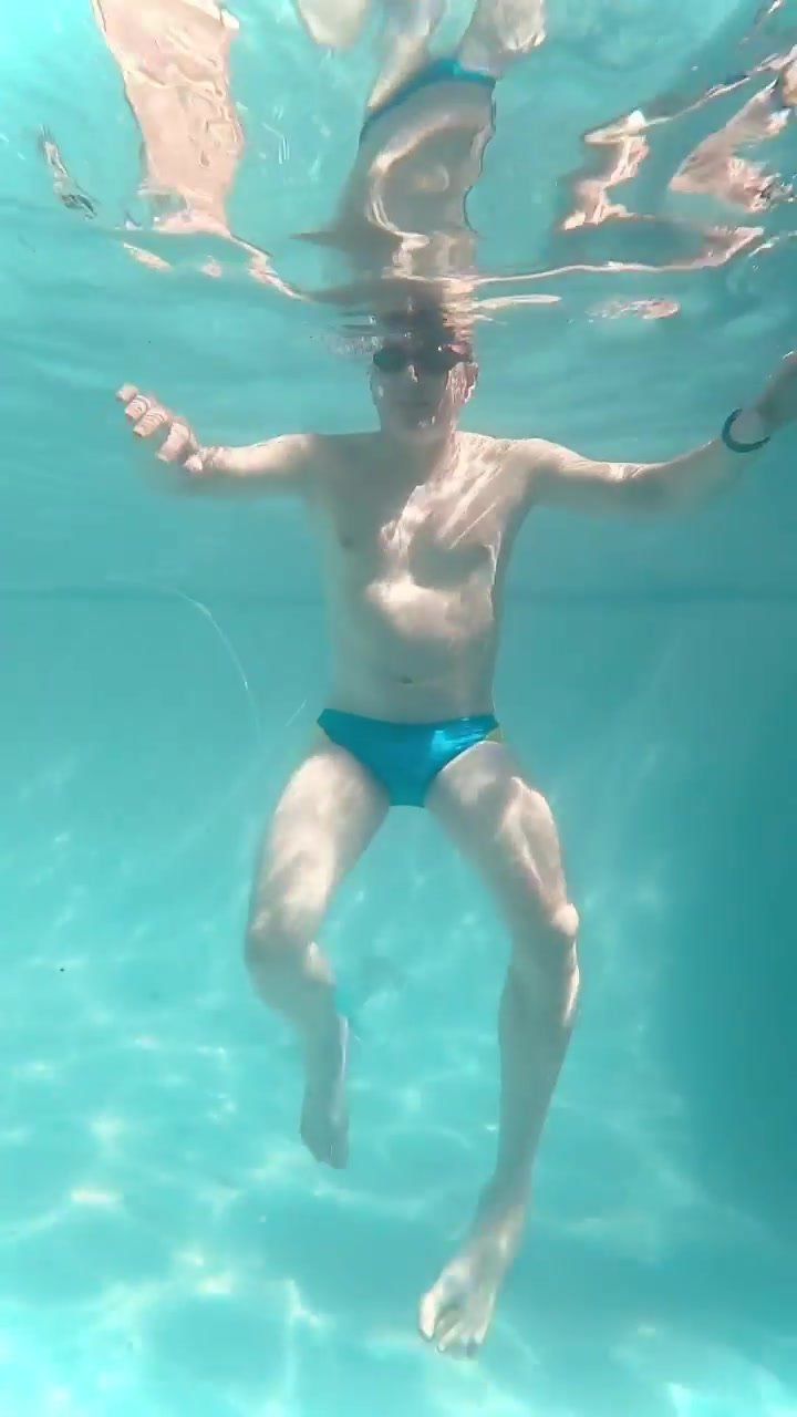 Underwater in bulging blue speedos
