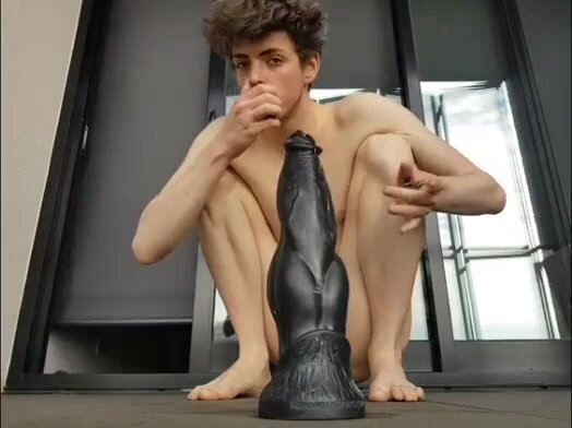 Young gay downs ass on the huge black dildo