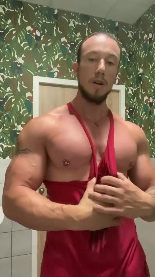 Showing off his big round tits for you