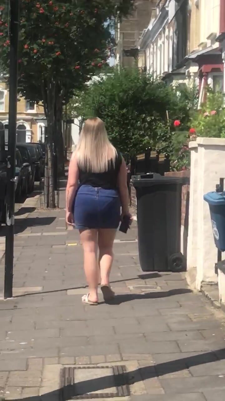 Sexy blonde walking in short skirt