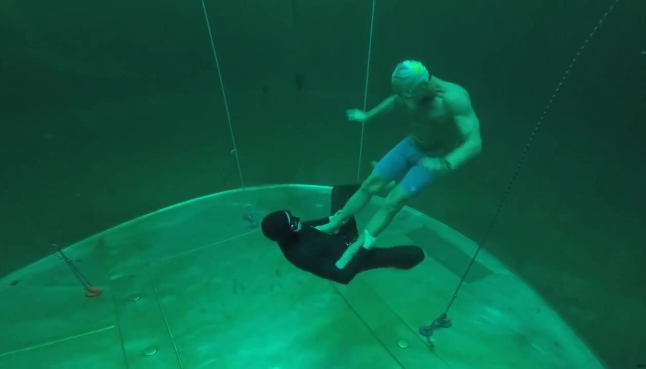 Underwater fighters in wetsuits