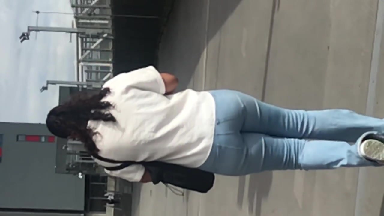 Brunette ass walking in jeans close up