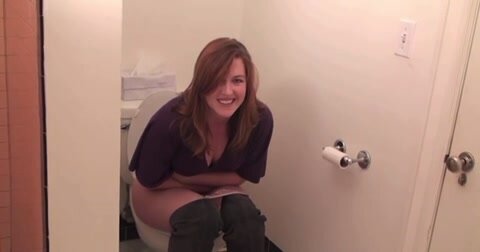 Cute redhead pooping