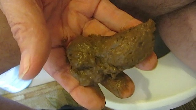 Fingering a turd to Eat
