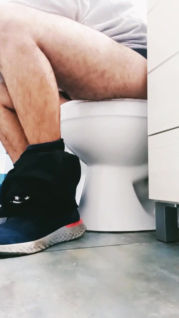 guy with hairy legs shitting in the bathroom