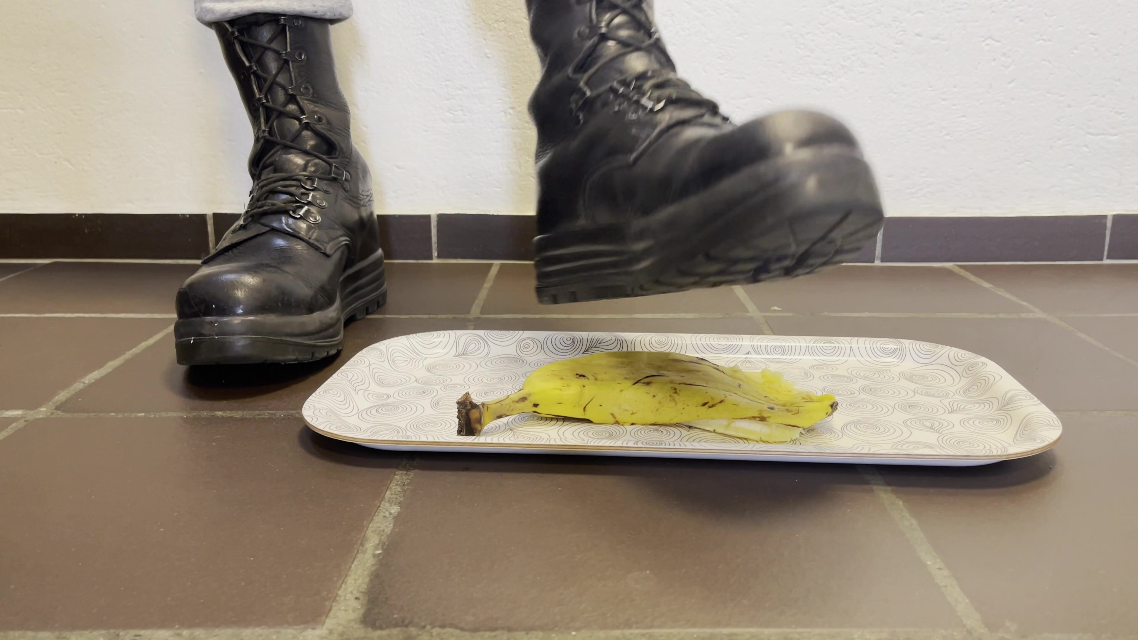Swiss military Boots crushing a banana