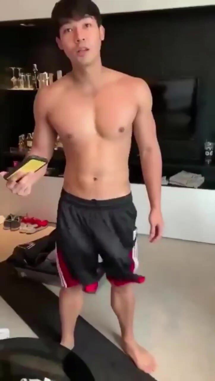 Big dick Asian swings dick through shorts