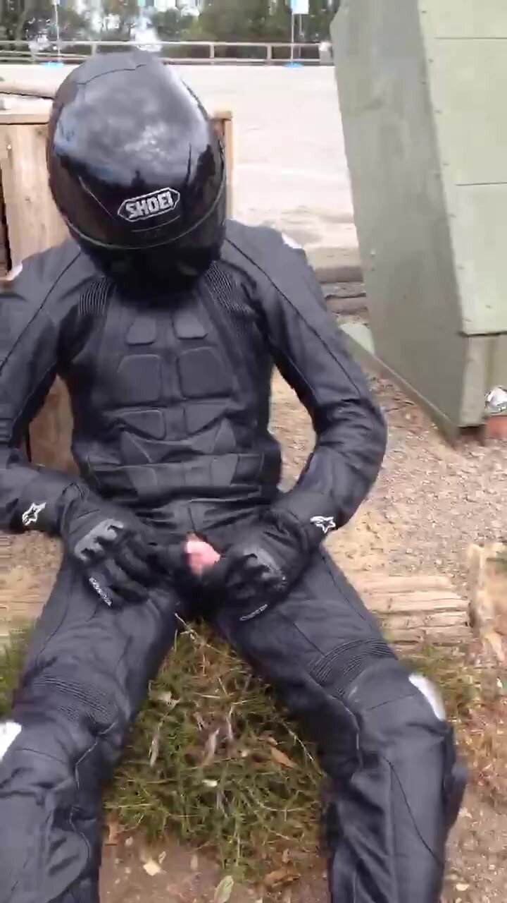 Biker pissing on his dainese suit
