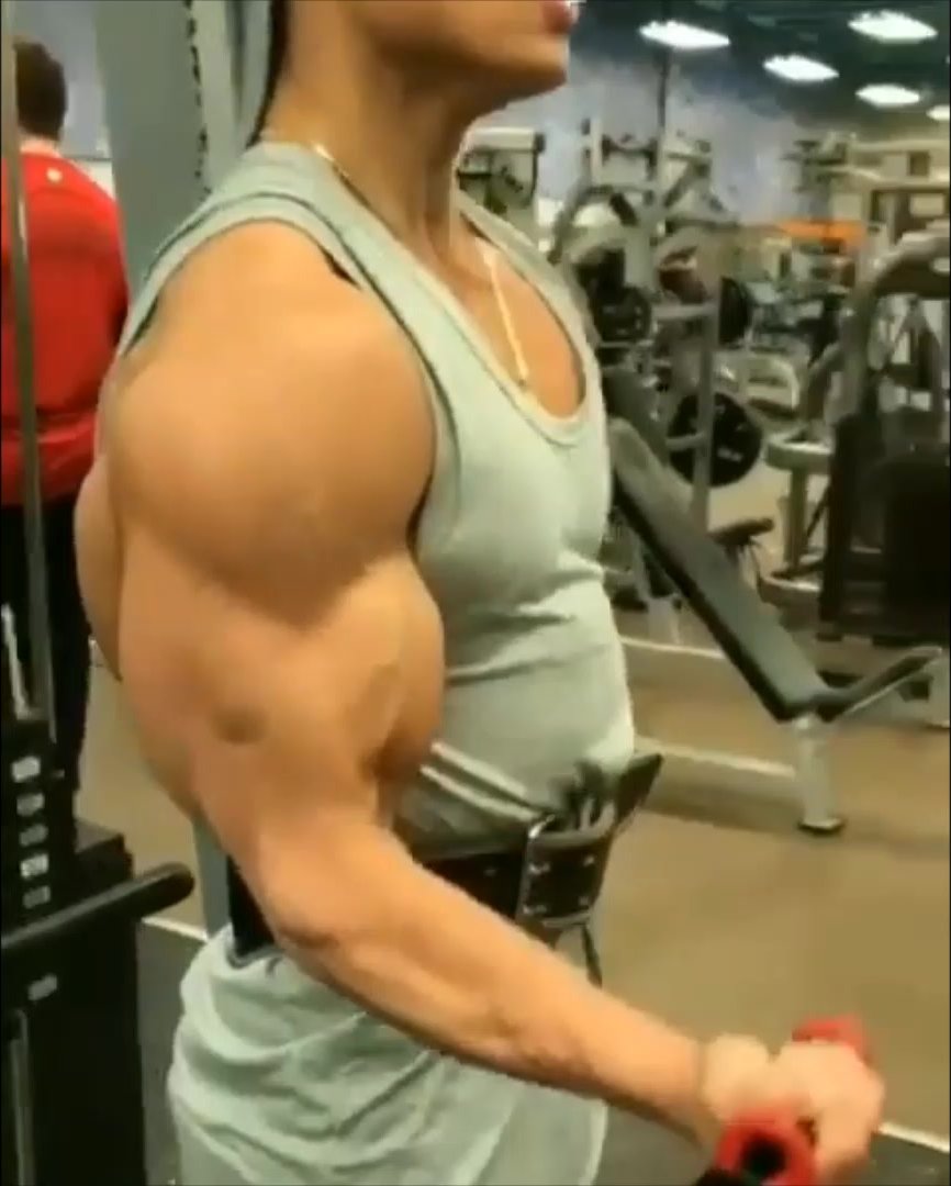 muscle hunk does a workout and flexes biceps