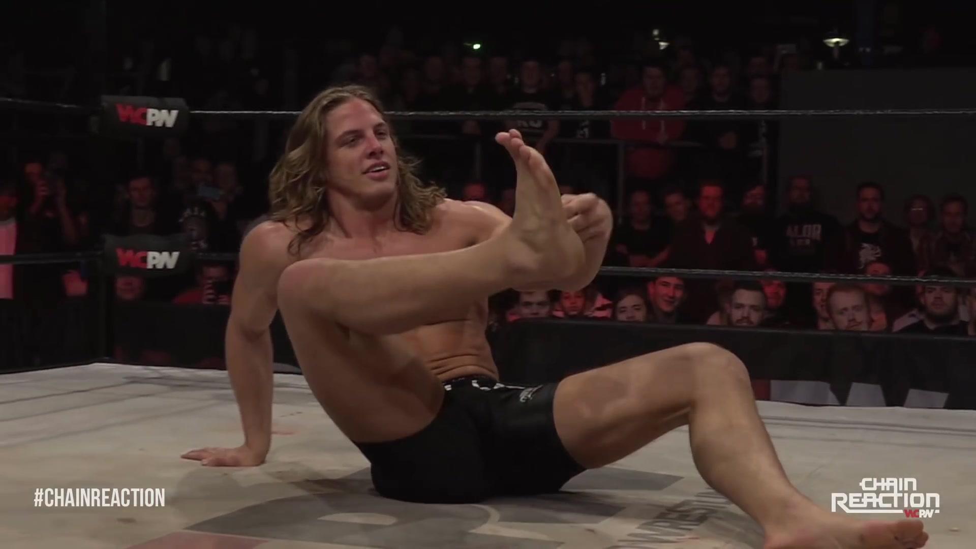 Wrestler Crushes Opponent's Hands and Flips Him with His Bare Feet