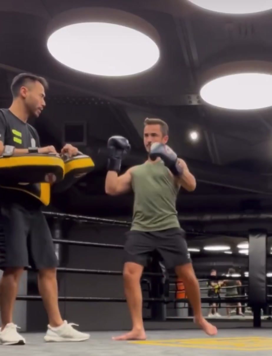 Hot model toning his body with kickboxing