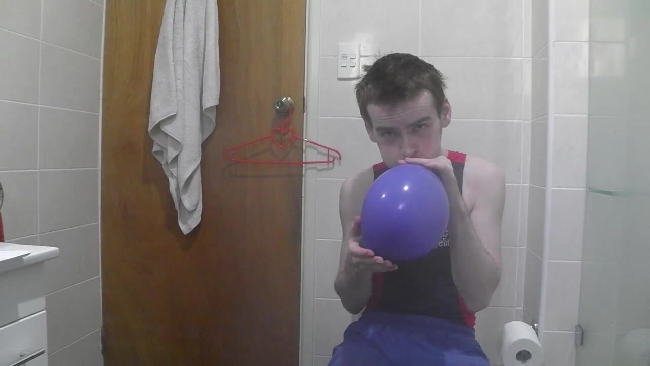 man blow balloon