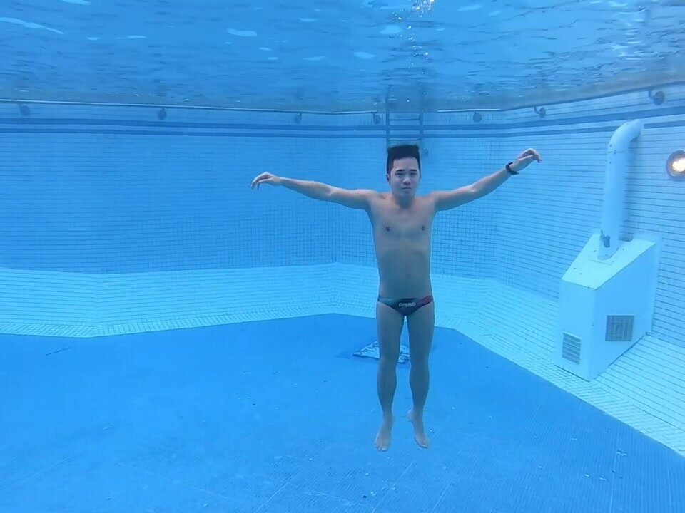 Shaved pits asian barefaced underwater in speedos