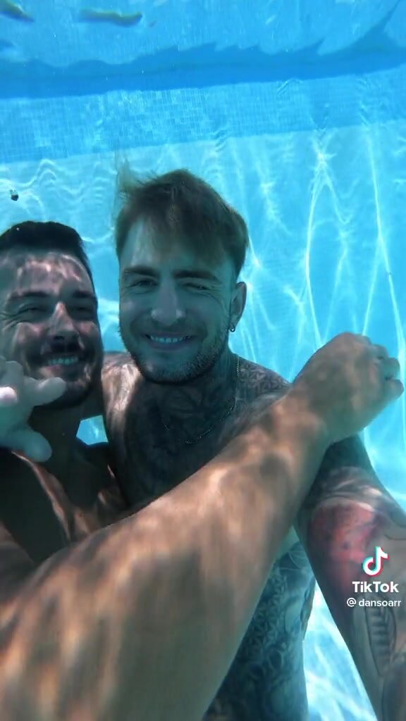 Underwater barefaced gay couple