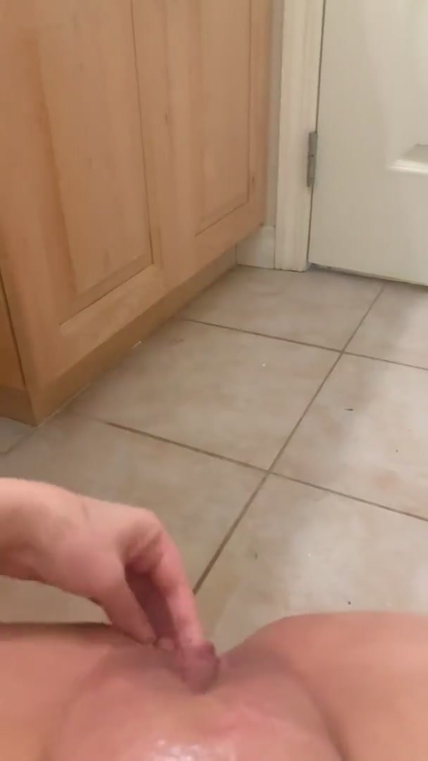 Girl pissing on her bathroom floor