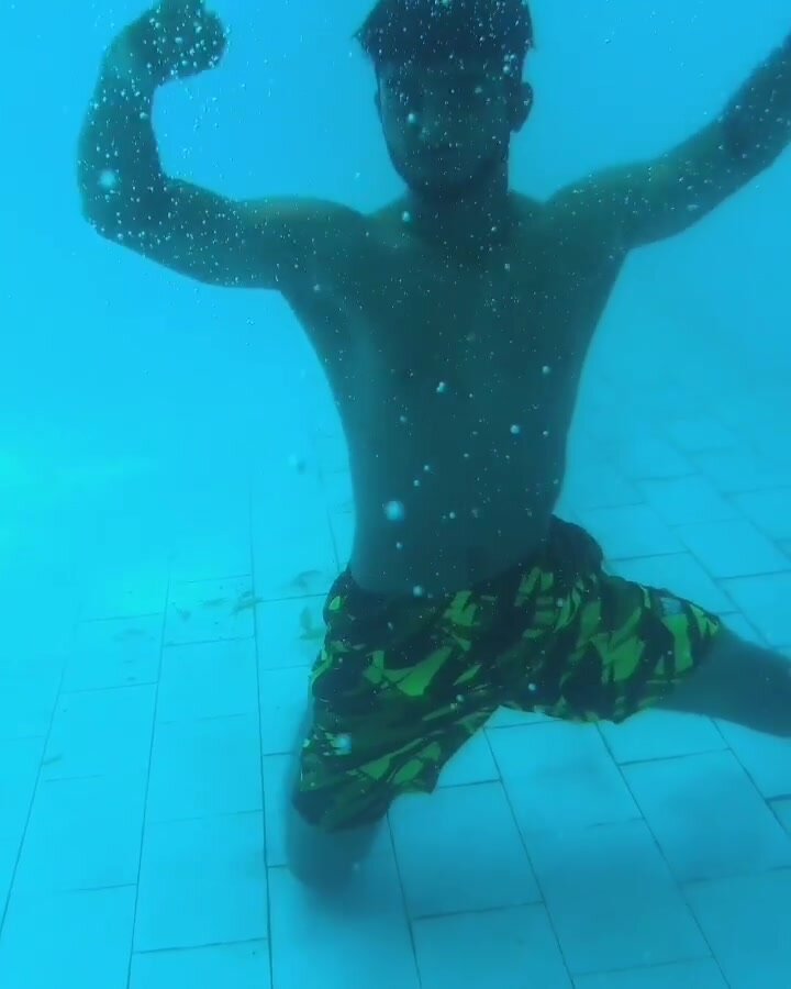 Barefaced hunk showing off underwater