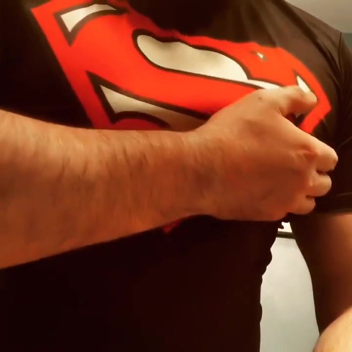 superman jiggles his hairy pecs