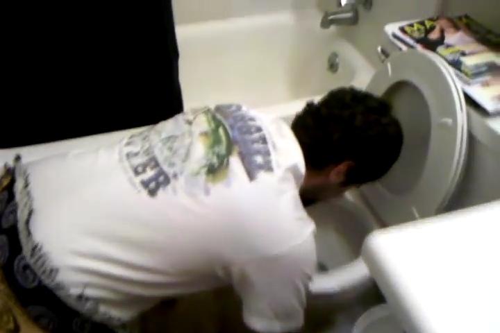Guy comforted while vomiting, barfing, puking, spewing