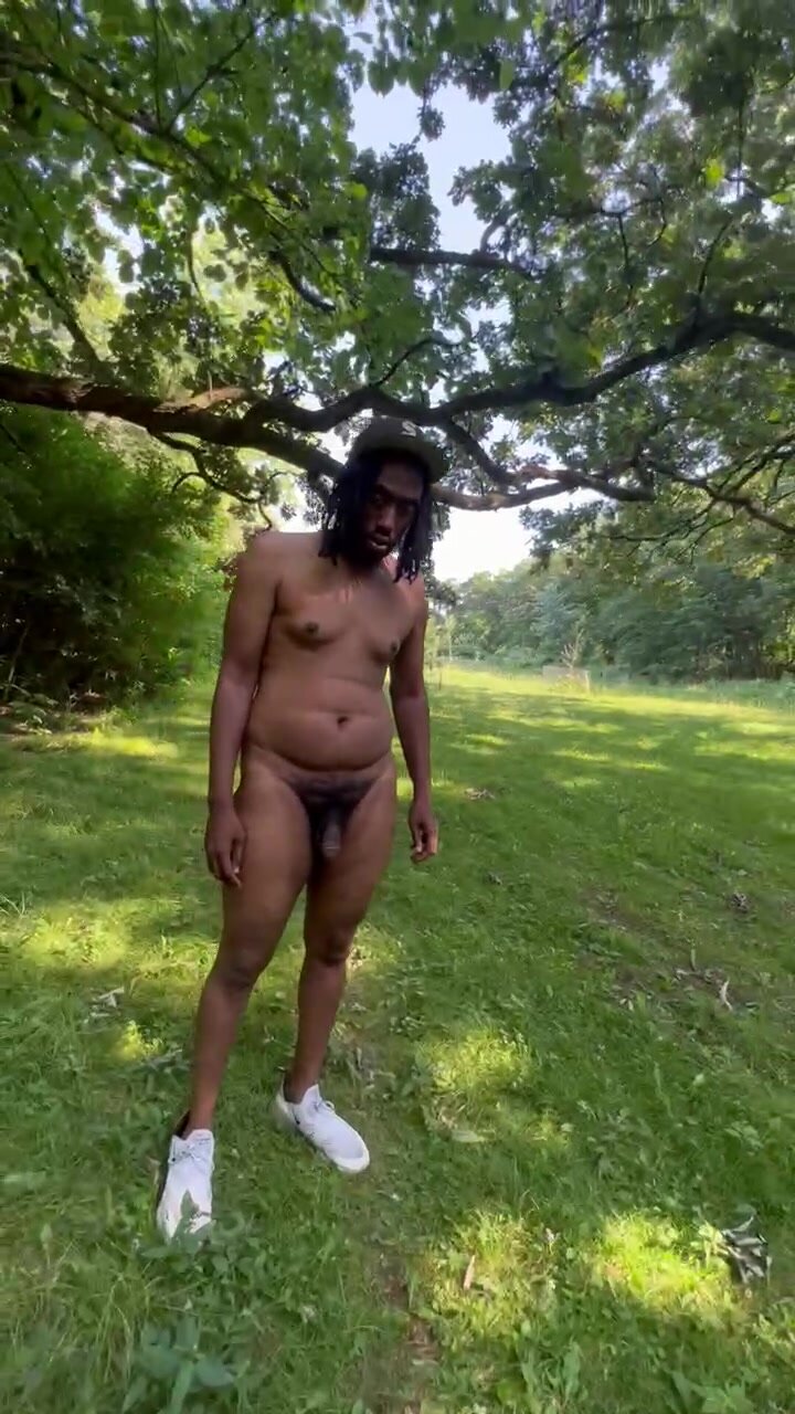 Chubby walks into open field naked