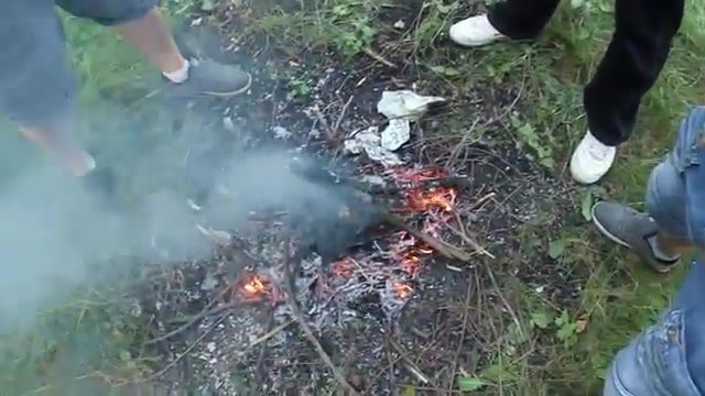 Pissing together on a fire